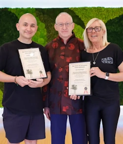Justin Lee Sato and Dot Hutchings of the Glass House Retreat with their instructor awards.